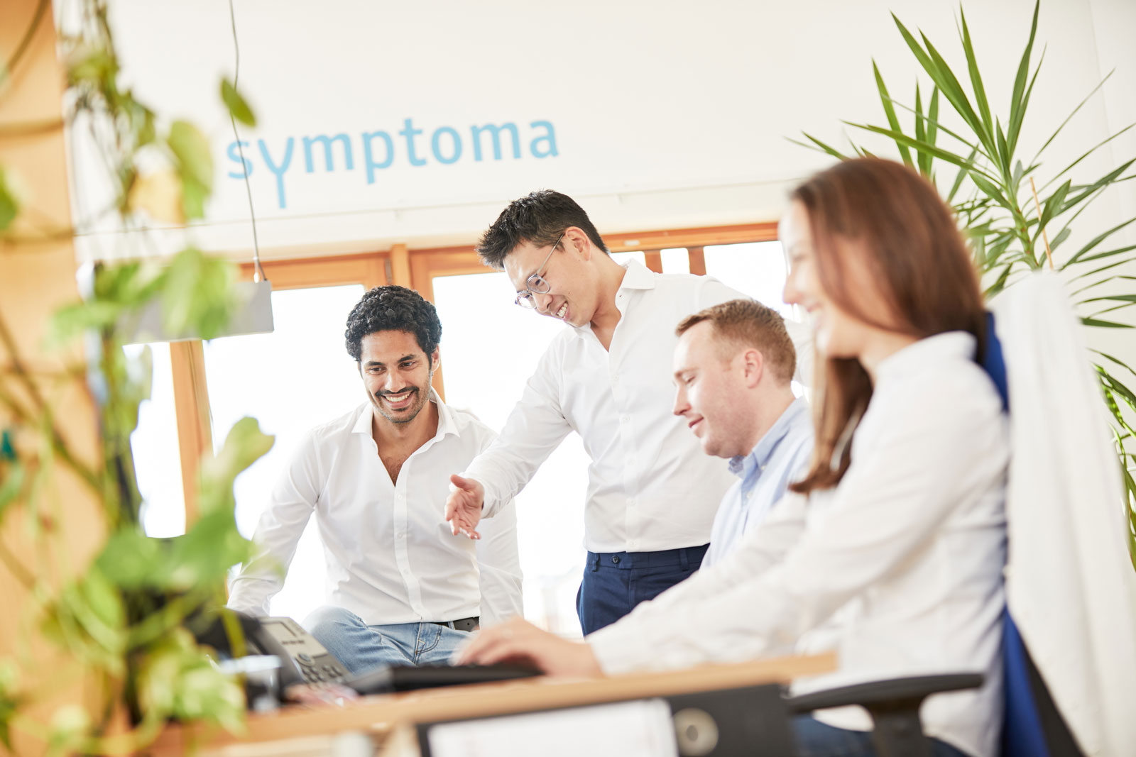 Die Symptoma-Gründer mit Mitarbeitern 